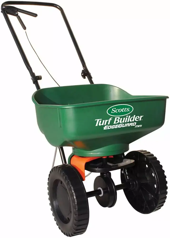 Scotts Turf Builder EdgeGuard Mini Broadcast Spreader - Spreads Grass Seed. Fertilizer and Ice Melt - Holds up to 5.000 sq...